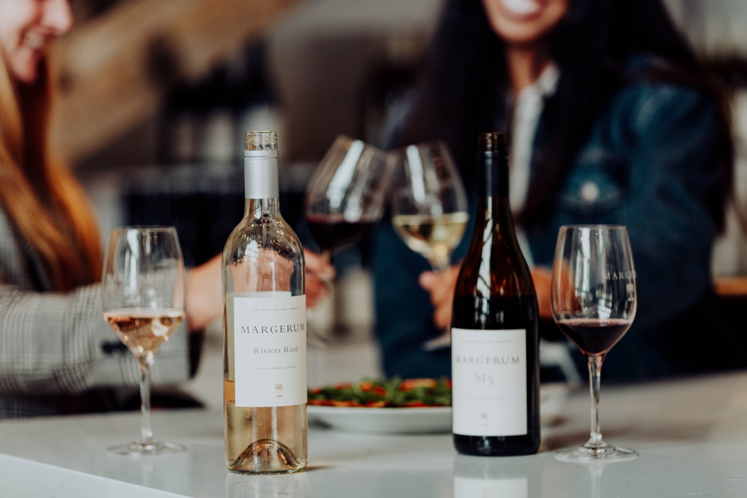 Margerum wines and glasses on the table